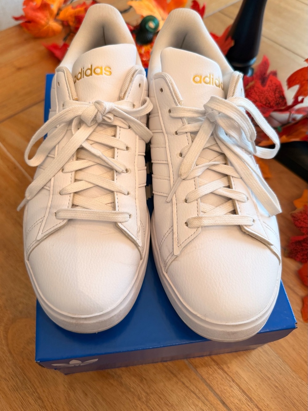 adidas White Sneakers with Gold Branding